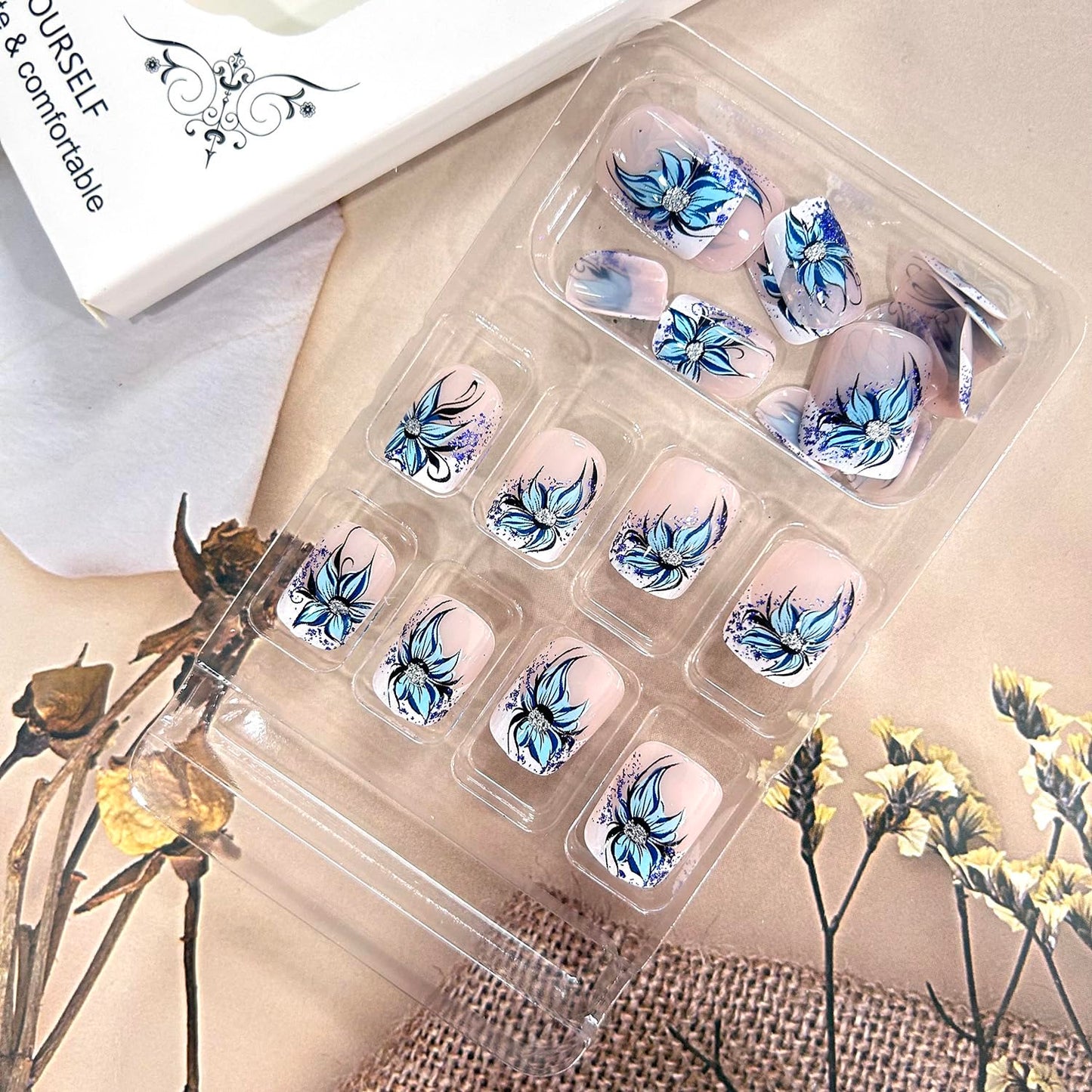 TBRZTR Blue Flower Press on Nails Short Square Artificial Coffin Nails Press Nails with Charm Acrylic Nails Nude False Nails Full Cover Glue on Nails Reusable Stick on Nails for Women 24Pcs