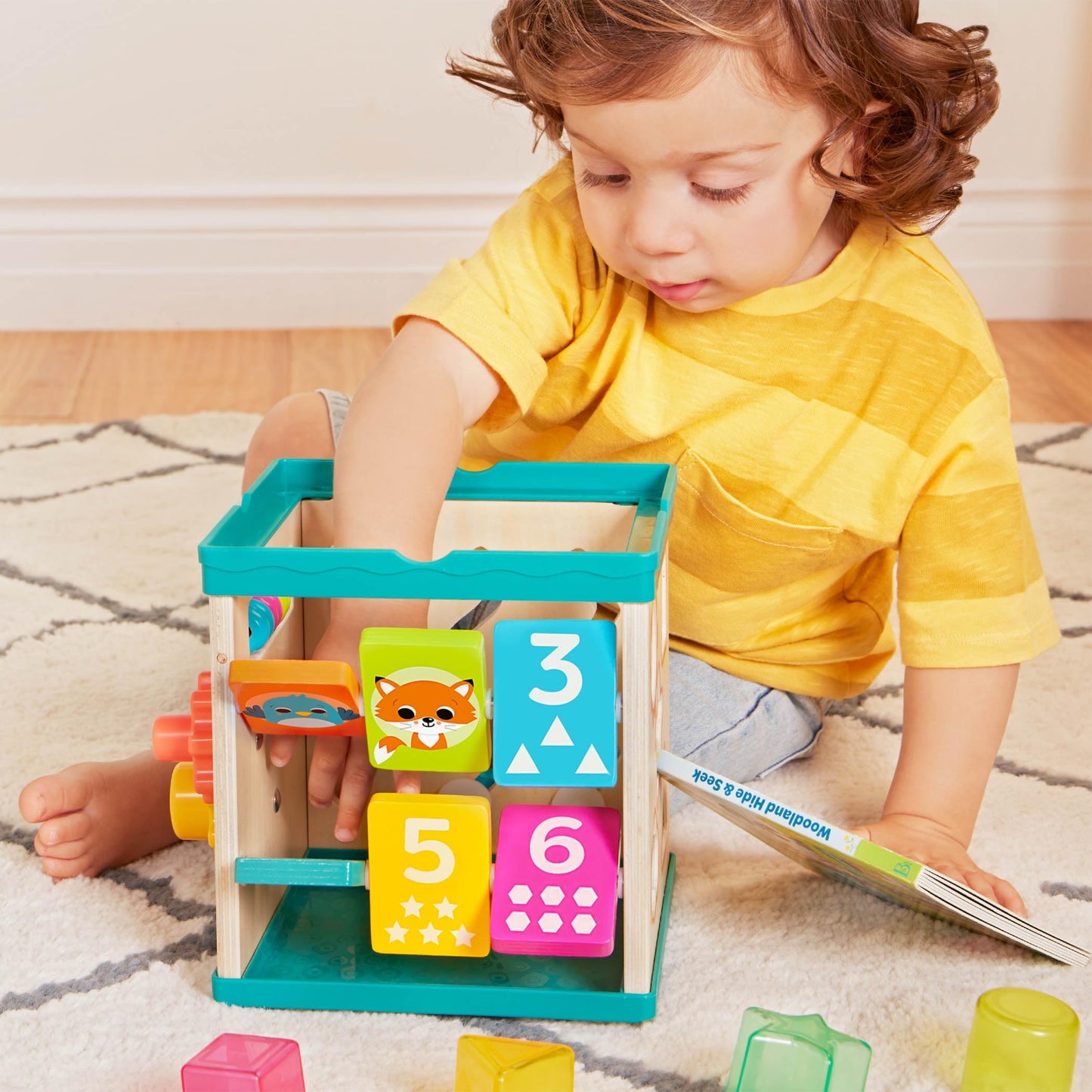B. toys – Tabletop Activity Cube – Educational Storybook Included – Wooden Shape Sorter, Bead Maze, Animal Tiles – Top Flips for Compact Storage – 12+ Months – Lil' Learning Cube