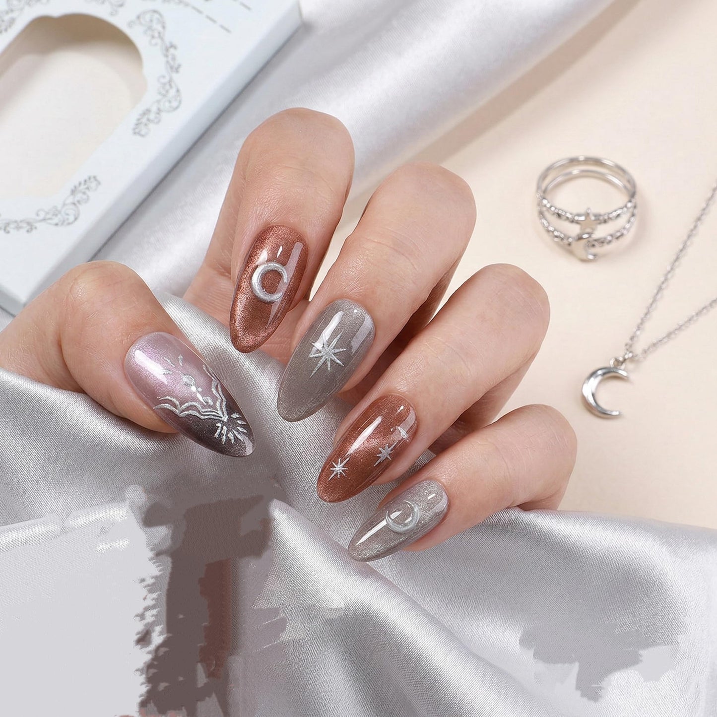 Long Press on Nails Almond Fake Nails Brown and Silver Acrylic Nail Press ons Seeneey Moon and Silver Floral Charm Designs Cat eye Stick on Nail for Women 24pcs