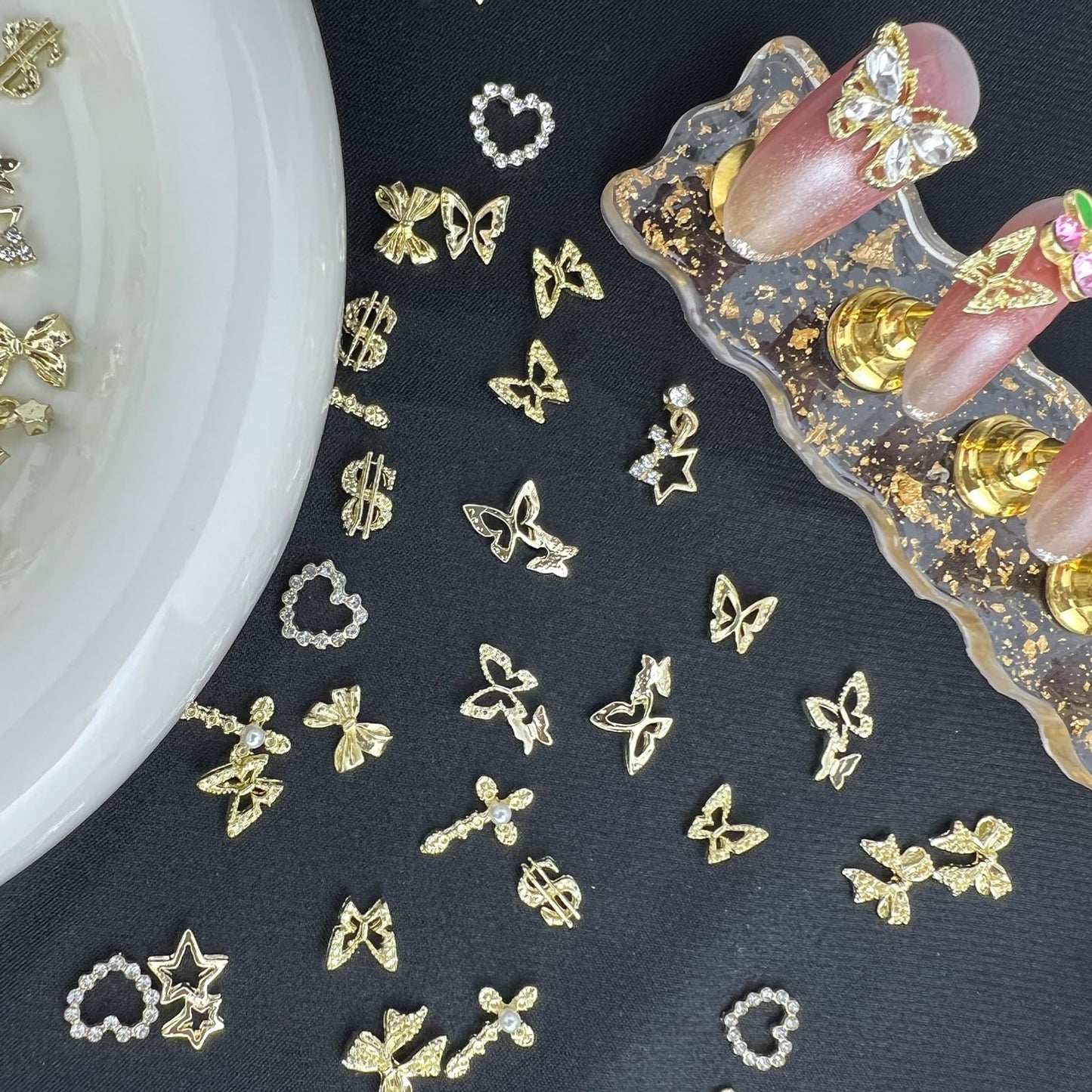 100 Pcs 3D Gold Nail Charms with Cherry Butterfly Cross Bow Star Heart Dollar for Women Nail Art DIY Design