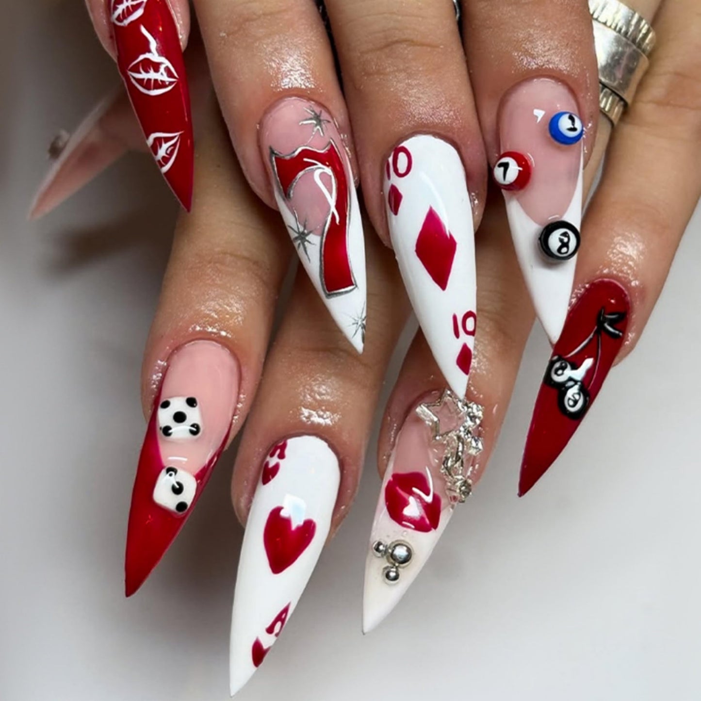 Stiletto Press on Nails Long Fake Nails Red Acrylic Nail Press ons Seeneey Poker Seven Designs Silver Charm Stick on Nail for Women 24pcs