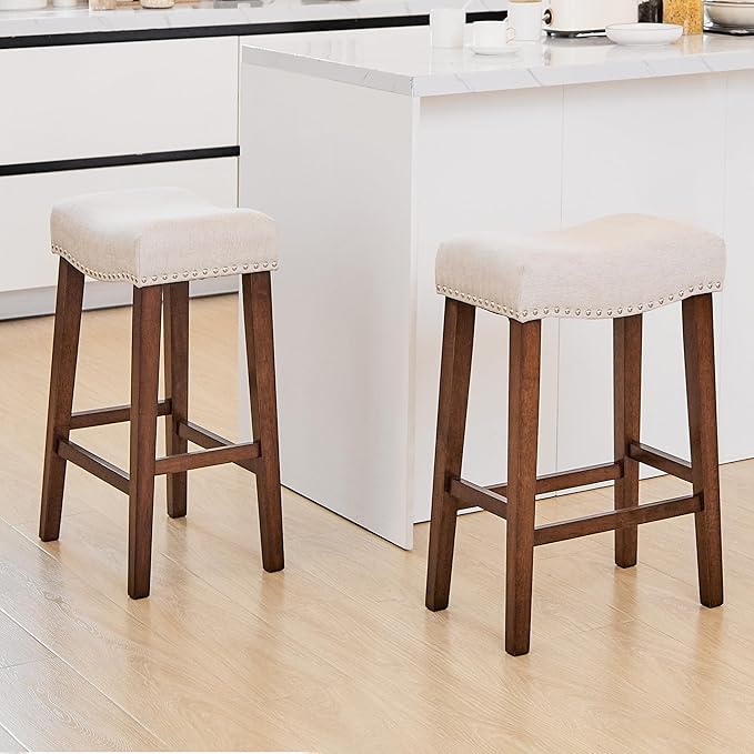 PrimeZone Counter Height Bar Stools Set of 2 - Backless Saddle Barstools with 4.3" Thick Upholstered, Nailhead Trim Linen Fabric & Solid Wood Legs, 26 Inch Counter Stools for Kitchen Island, Beige