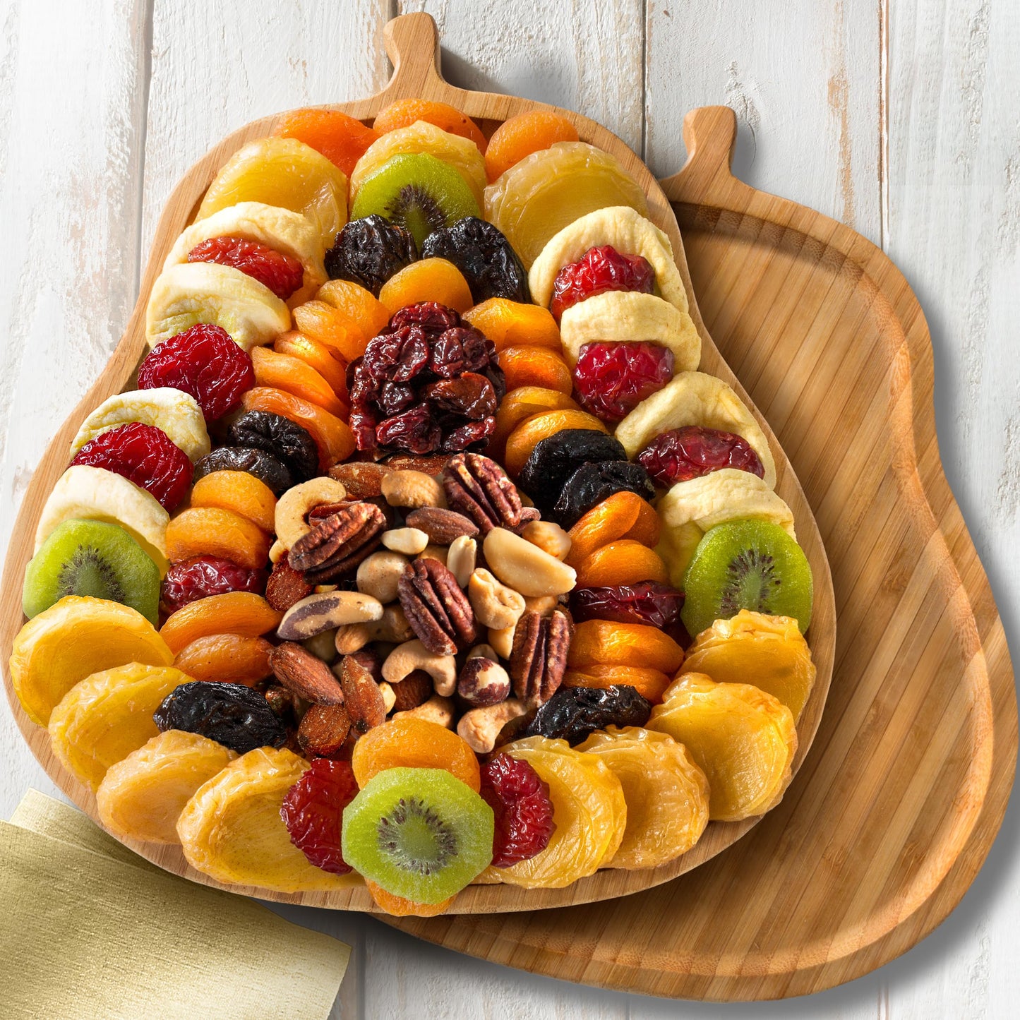 A Gift Inside Festive Dried Fruit and Nuts on Bamboo Pear Shaped Cutting Board